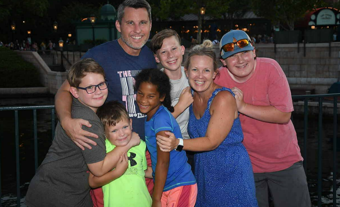 Pollard Family Hugging At Epcot